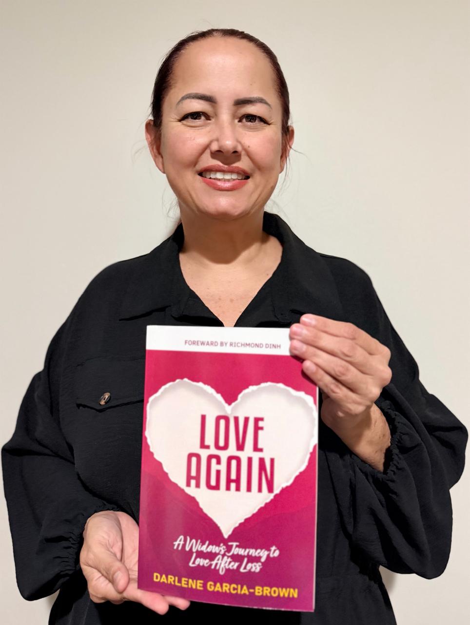 Widow holding Love Again book